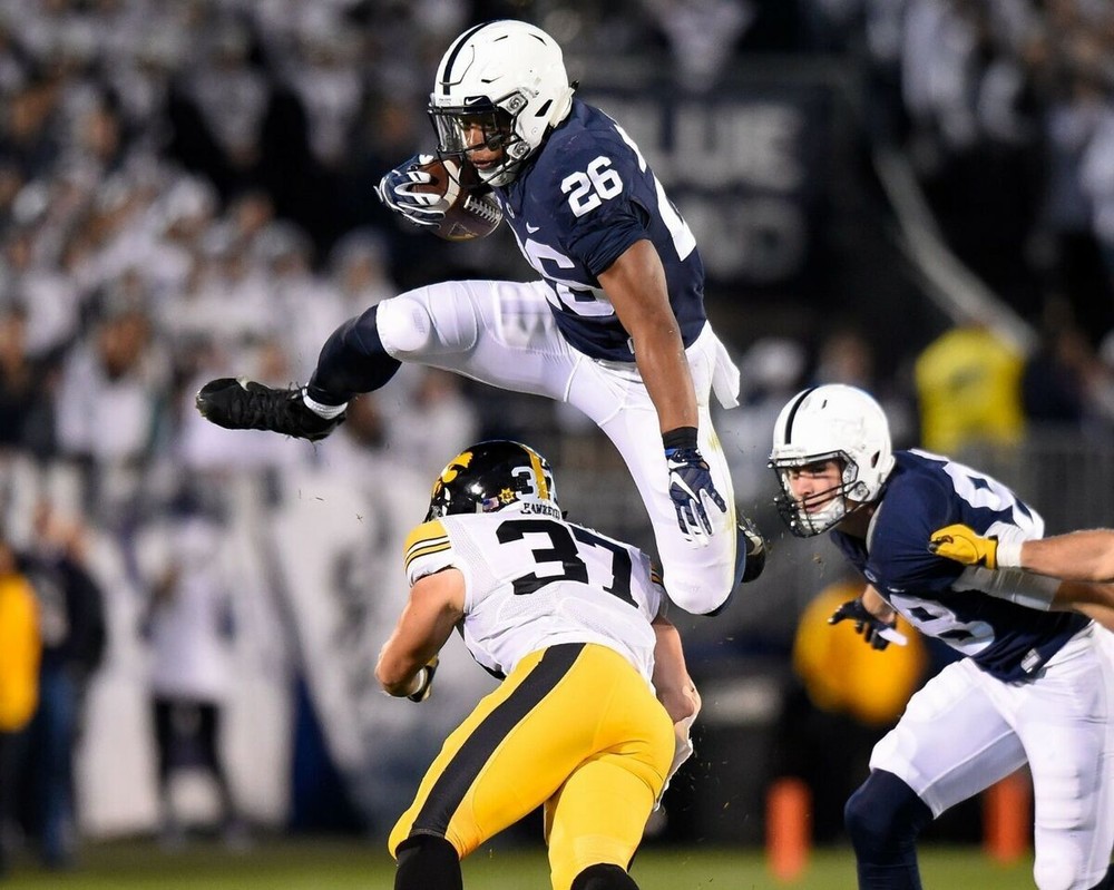 Saquon Barkley Penn State Nittany Lions NCAA Running And Jumping Over Someone 8x