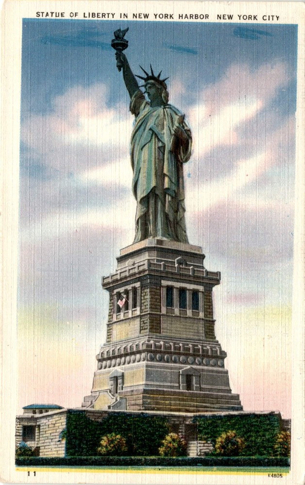 Statue of Liberty postcard featuring New York Harbor and NYC skyline from Bedloe's Island