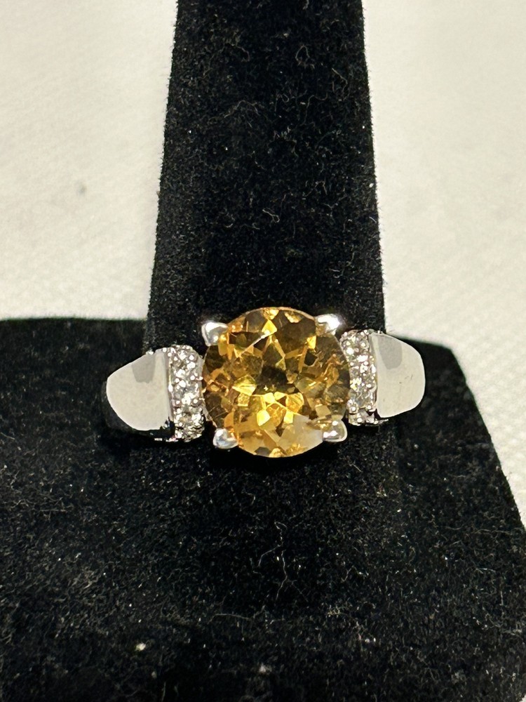 Elegant women's size 9 silver ring featuring large citrine and white topaz accents, new with tag