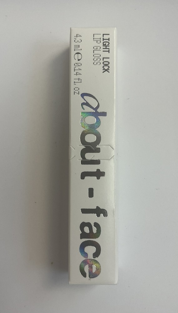 About Face Light Lock Lip Gloss in BLAME GAME .14 oz New Formula-image