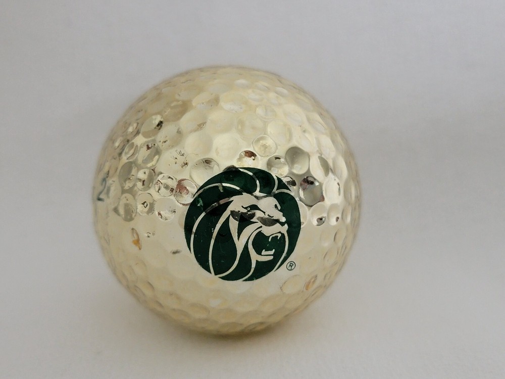 MGM Lion MGM Grand PXi Logo Golf Ball Gold colored golf ball with green imprint