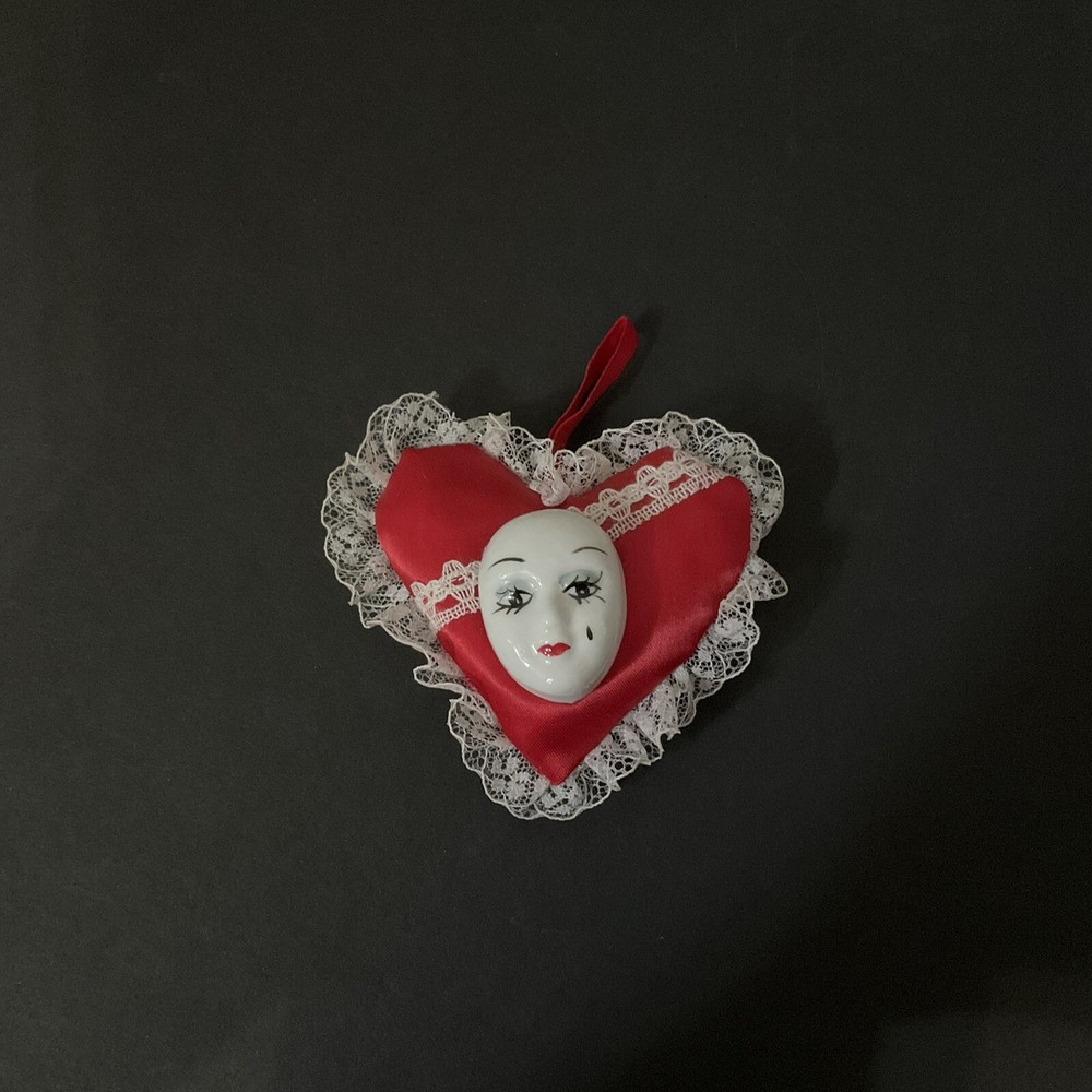 Vintage Hanging Porcelain Mardi Gras Mask On A Red Heart Pillow With White Lace