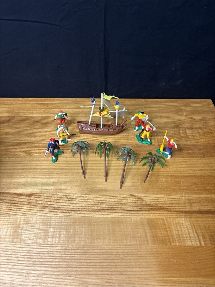 Vintage 1970s pirate treasure ship and rusty crew cake topper collectible