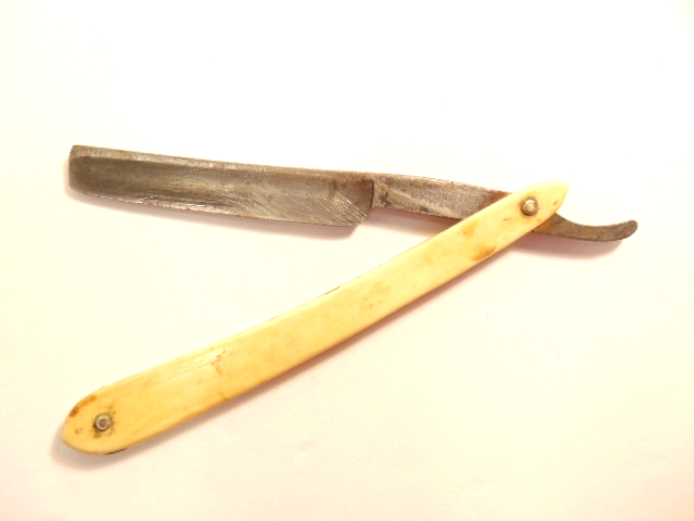 vintage Geo. Worthington, Cleveland, Ohio straight razor with whitish handle