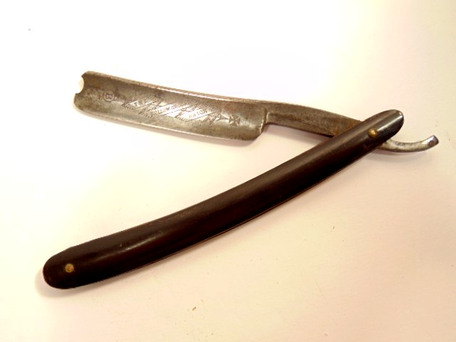 old Wade & Butcher, Sheffield England Hollow Ground straight razor; etched blade