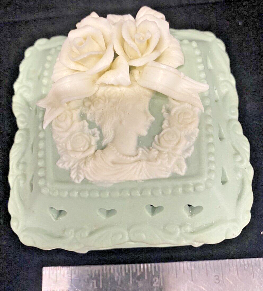 Light green porcelain trinket box featuring a 3D rose design and a woman’s face for elegant storage